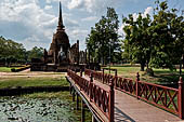 Thailand, Old Sukhothai - Wat Sa Si. The main chedi seen from the bridge leading to the island with the ubosot. 